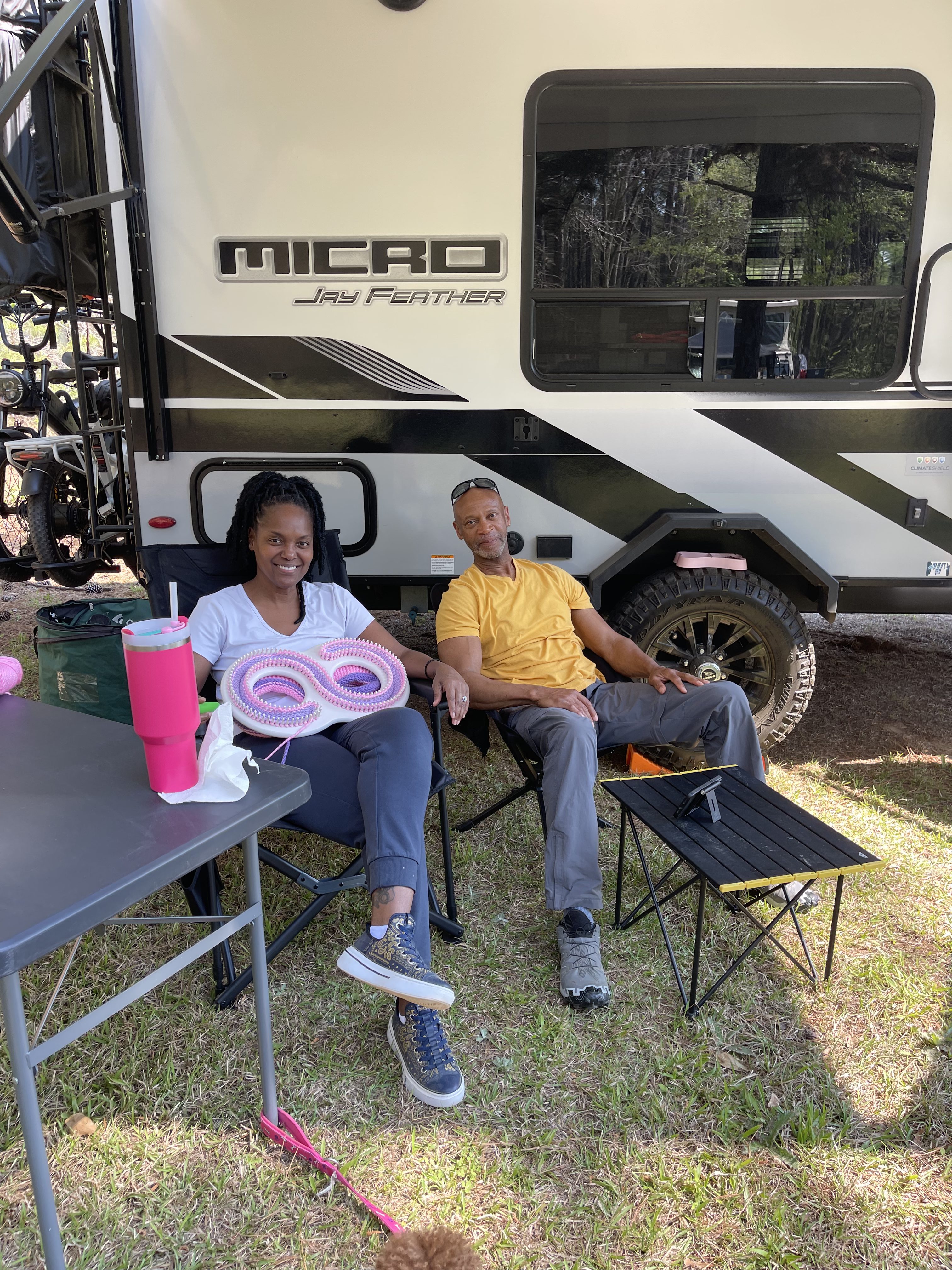 AVR campers relaxing next to RV
